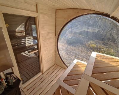 Sauna z okrągłym oknem panoramicznym. „Rybie oko w saunie”